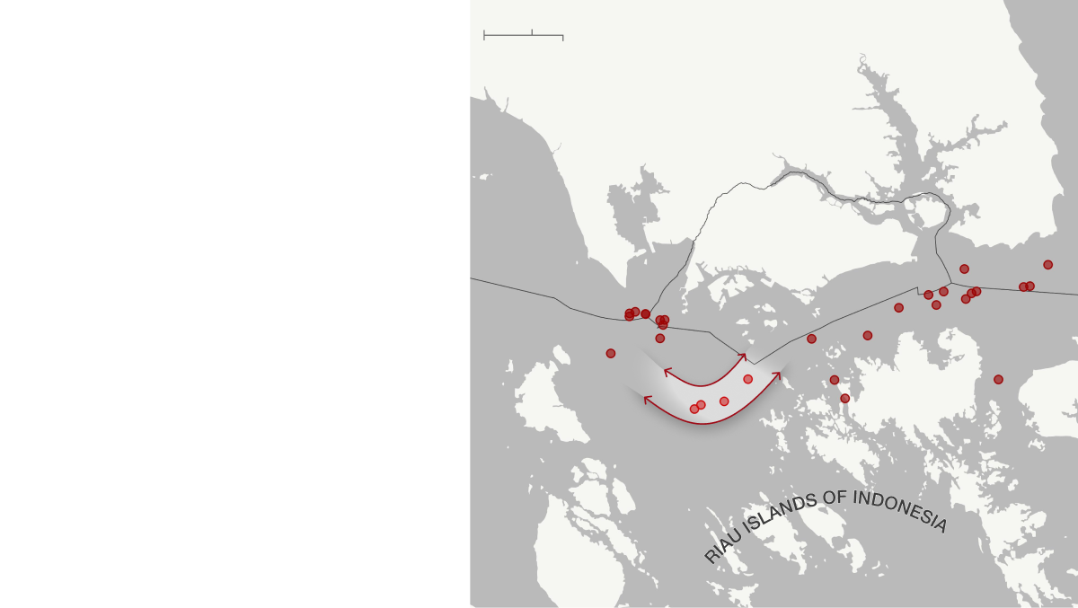 Singapore and the Riau Islands are shown on two maps. This image is the first map. The water is grey while the land is off-white. Attacks are shown via red dots in the map's waters. One map depicts the Singapore Strait in 2019 with 39 attacks irregularly distributed throughout the strait. A turn within the Phillip Channel of the strait is highlighted light grey with red arrows. This highlighted segment includes four attacks. Under the arrows, text reads, 