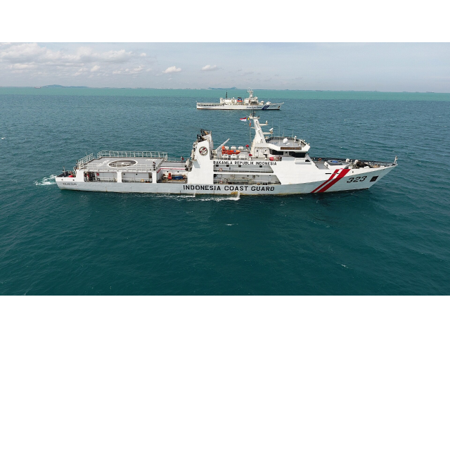 An photograph depicts two coast guard ships sailing on blue waters. One ship is in the foreground and one ship is in the background. The ship in the foreground reads, “INDONESIA COAST GAURD” on the side. It also reads “323” at the front of the ship and has two stripes near the front.

The black text reads, “February 2, 2022

Indonesian and Japanese ships conduct anti-piracy exercises in the Singapore Strait.”