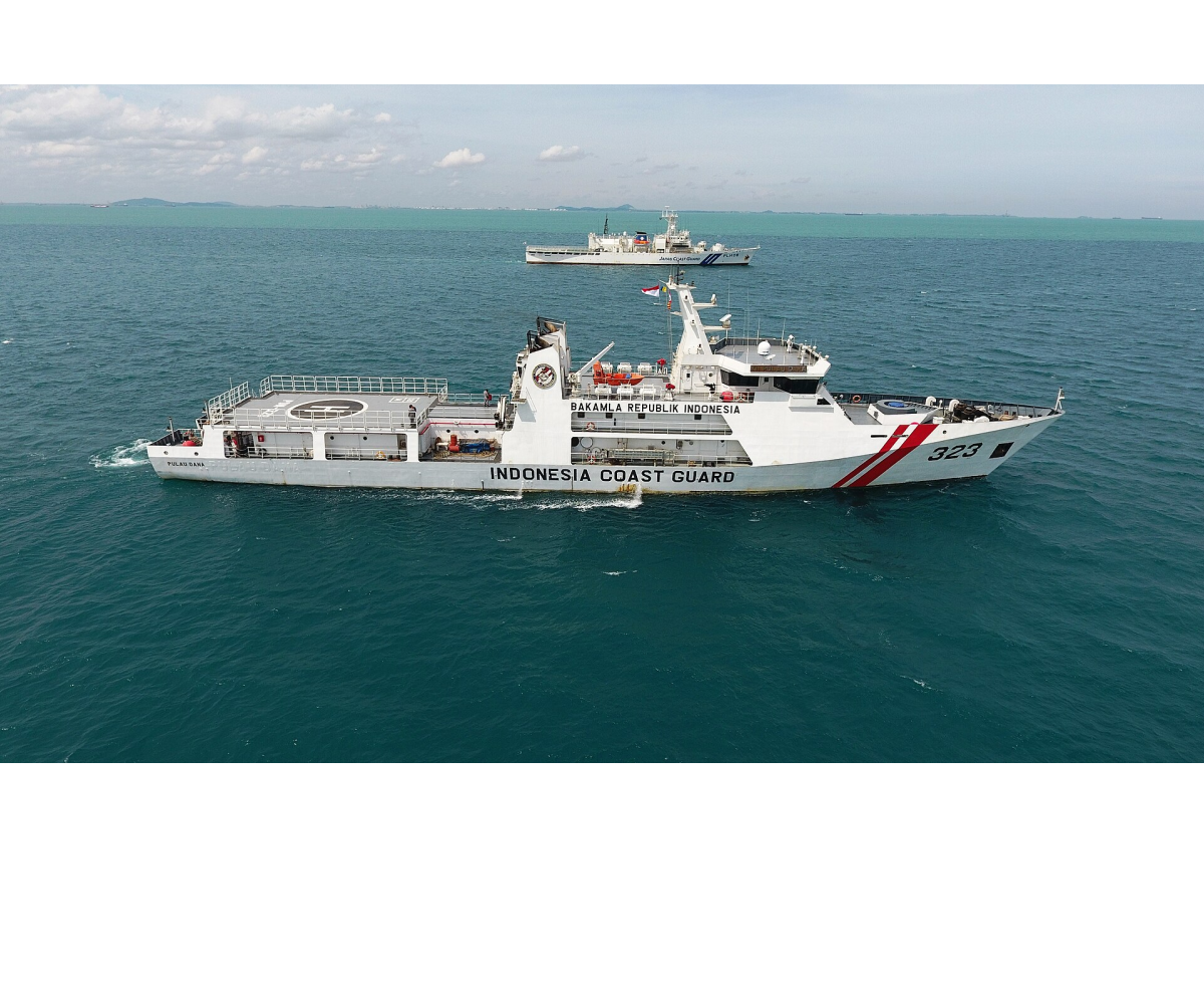 An photograph depicts two coast guard ships sailing on blue waters. One ship is in the foreground and one ship is in the background. The ship in the foreground reads, “INDONESIA COAST GAURD” on the side. It also reads “323” at the front of the ship and has two stripes near the front.

The black text reads, “February 2, 2022

Indonesian and Japanese ships conduct anti-piracy exercises in the Singapore Strait.”
